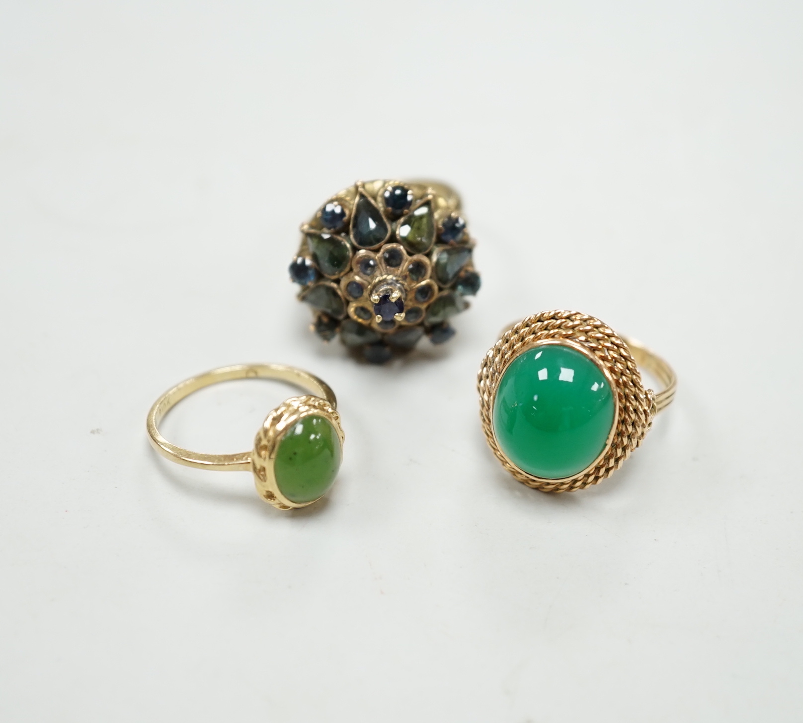 Three assorted yellow metal and gem set dress rings, including 14k and 10k, gross weight 13.2 grams.